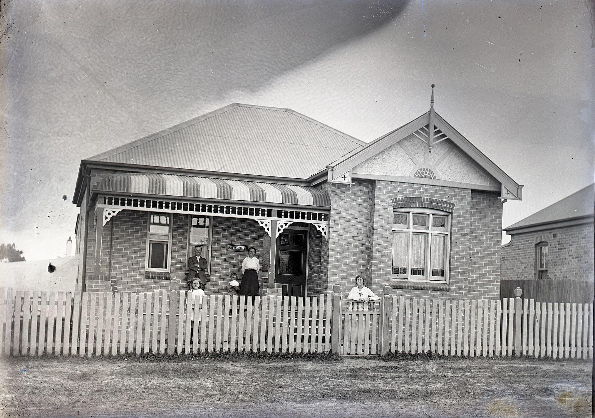 A Federation-era brick house at Attercliffe, Punchbowl, New South Wales, the clay-brick skin that still dominates Australian suburbs.