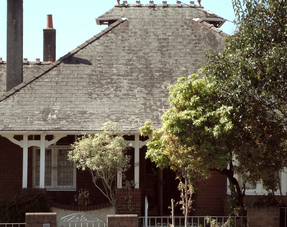 A Federation-era brick house behind a front garden, typical of established Australian suburbs.