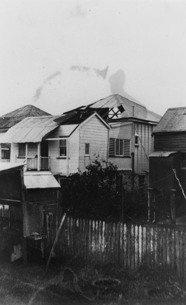 A Cairns house with part of its roof torn away after a cyclone in 1927.